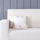 Off-white Chanderi cushion cover set with woven floral motifs styled on a sofa adding elegant traditional charm to home decor