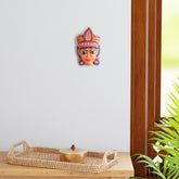 Hand-carved Durga Gomira wooden wall mask displayed as living room wall decor, showcasing vibrant folk art and traditional Indian craftsmanship