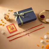 Handmade Om Rakhi and Lumba Set for Bhaiya Bhabhi presented in a luxury blue gift box for Raksha Bandhan gifting