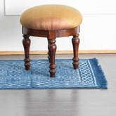 Handwoven indigo geometric dhurrie rug enhancing modern and traditional home décor