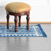 Hand block printed indigo cotton floor runner rug with geometric floral motifs measuring 6 x 2 ft