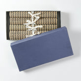 Handmade Madhurkathi table runner and placemat set packed in a gift box, featuring natural fibre weaving and a black zigzag pattern for thoughtful gifting