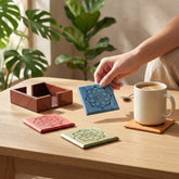 Wooden tea coaster set with Mandala pattern protecting the table while adding colour to a tea and coffee table setting.
