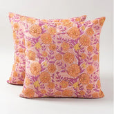 Set of 2 pink cushion covers of 16x 16 inches featuring marigold jaal hand block printed floral motifs in dark pink and orange