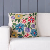 Multicolour floral hand embroidered crewel cushion cover styled on a sofa adding vibrant colour to living room decor
