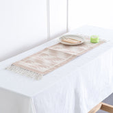 Off-white and beige geometric handwoven cotton floor cum table runner styled on a table as a minimalist home accent