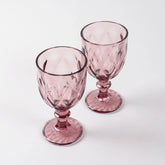 Set of two pink diamond wine glasses displayed against a clean background highlighting handcrafted glasswork