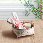 Handmade pink wicker basket for storage with floral decoupage artwork holding home accessories on a table, ideal for gifting and organisation