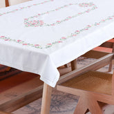 Rangoon creeper embroidered cutwork table cloth styled on a dining table for elegant dining table decor and entertaining