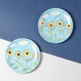 Sunflower ceramic dinner plate set of 2 with hand-painted floral artwork on a blue background, ideal for everyday dining and table settings