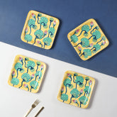 Hand-painted Waterlily ceramic square platter set of 4 featuring yellow, green, and pink floral motifs, styled as elegant snack platters for table settings