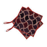 Fish Scale Ajrakh hand block printed cotton pot holders in brown and madder red with quilted padding and hanging loops, set of 2.