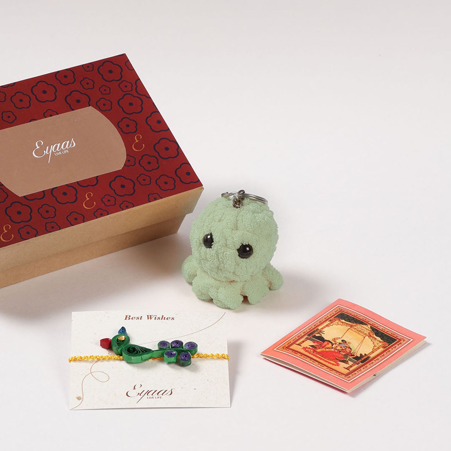 1 Quilled Rakhi, Crochet Toy & Roli Tika Gift Set, Peacock