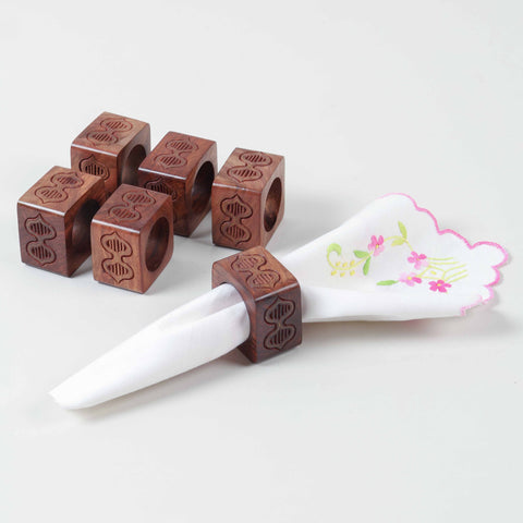 Styled brass inlay wooden napkin rings, ideal for holding table napkins and sophisticated table settings