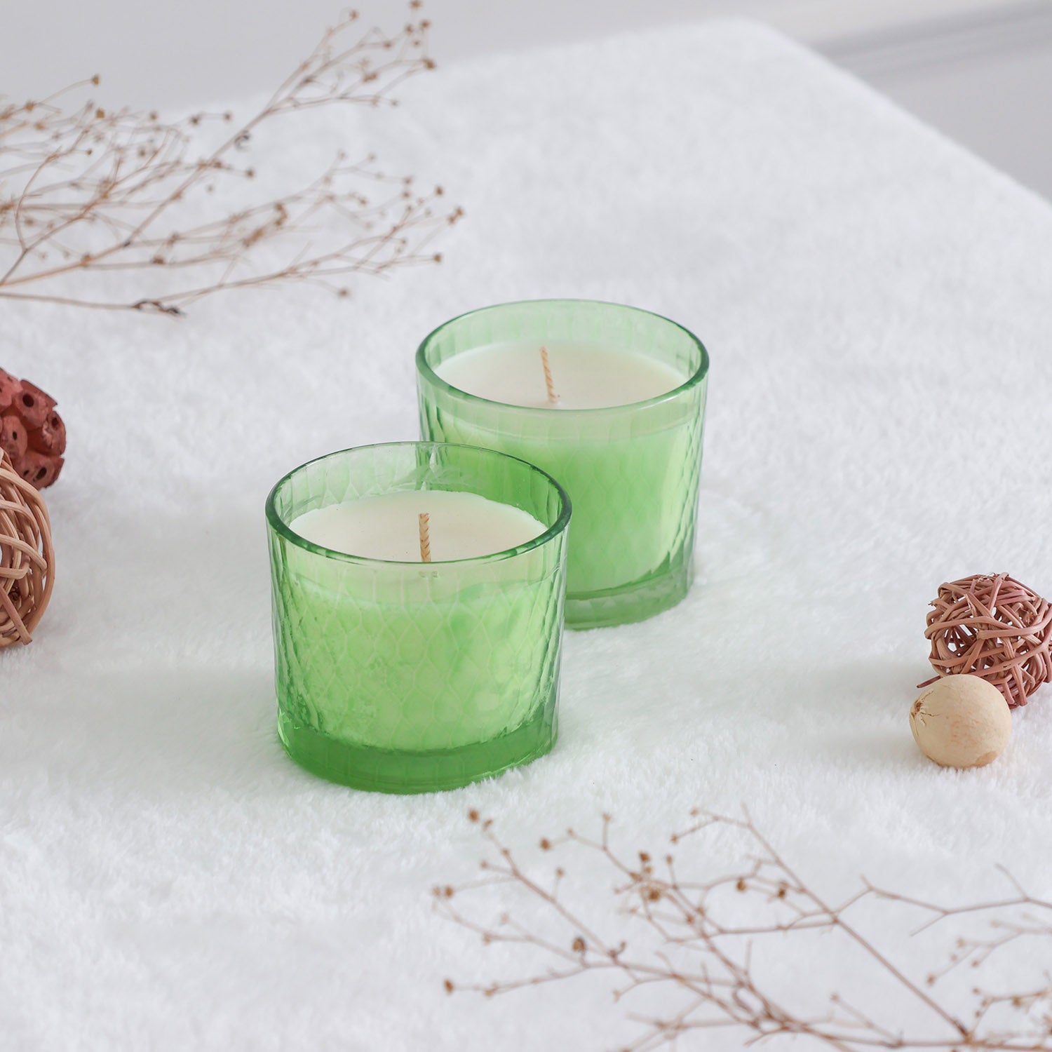 Decorative green glass candles with green apple fragrance, styled for festive gatherings and home entertaining
