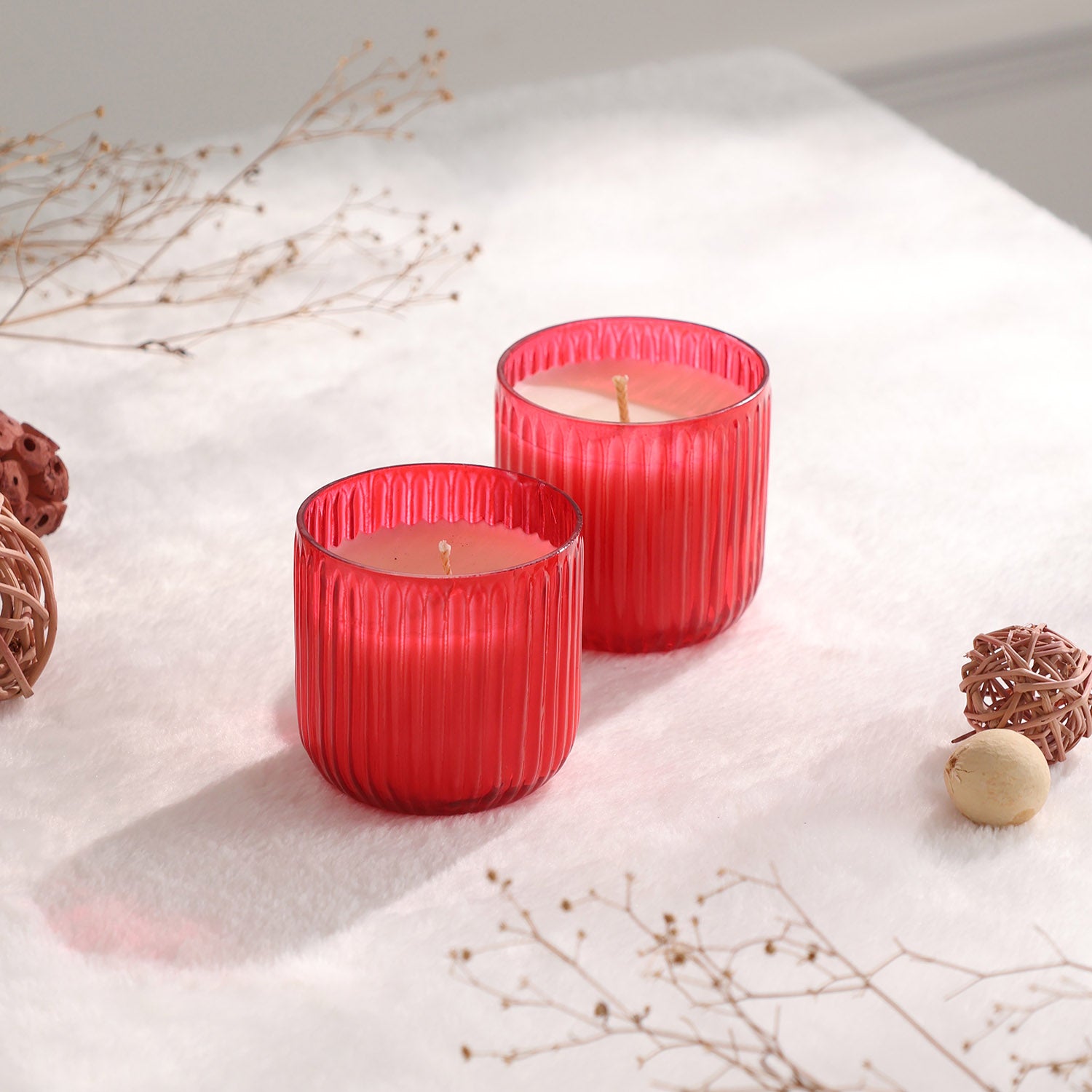 Apple cinnamon scented glass candles styled for cosy home decor and festive table settings