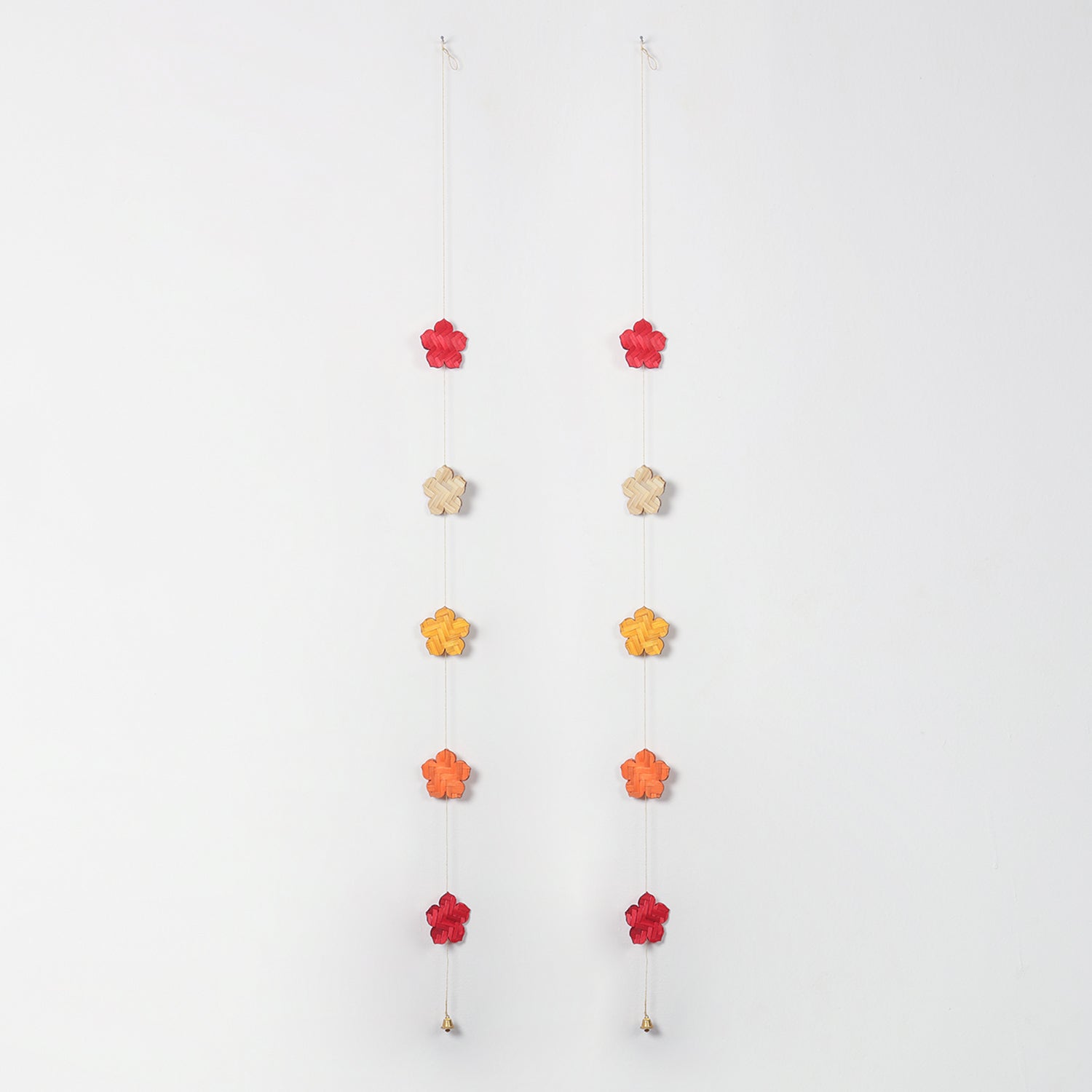 Full view of two handcrafted bamboo flower latkans in festive colours