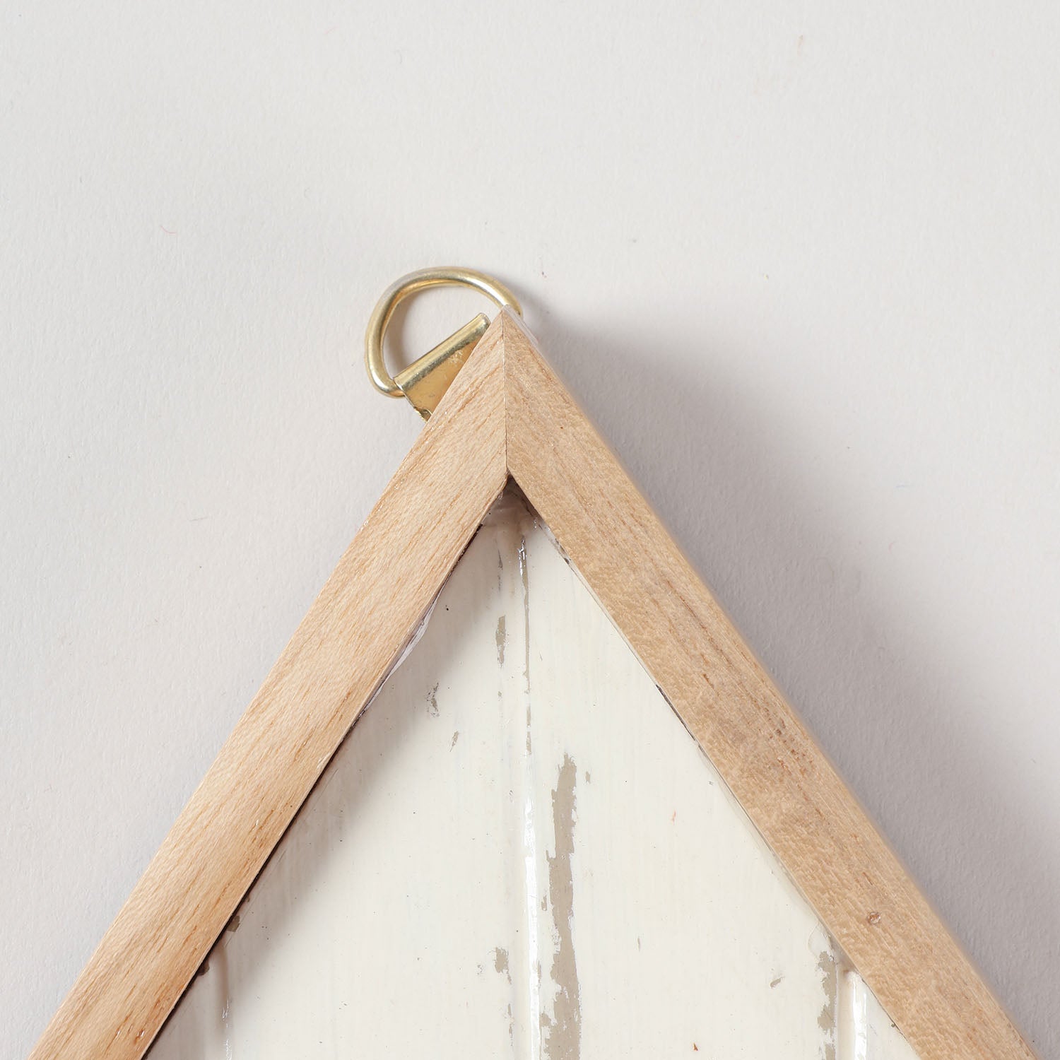 Close-up of the hanging loop on a handmade bamboo key holder showing sturdy wall mounting hardware and handcrafted construction