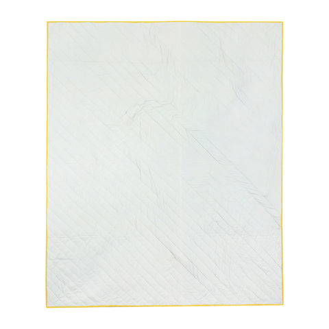 Back side of a cotton quilted bedcover showcasing plain breathable cotton construction