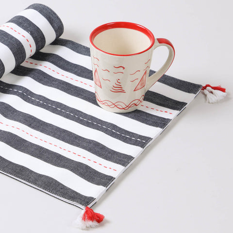 Black and white striped cotton table runner displayed on a center table as a stylish handmade home décor accent