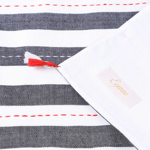 Detailed back and front view of a black and white hand-woven cotton table runner