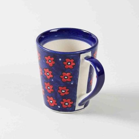 Front view of single blue floral hand-painted ceramic coffee mugs showcasing shape and decorative artwork