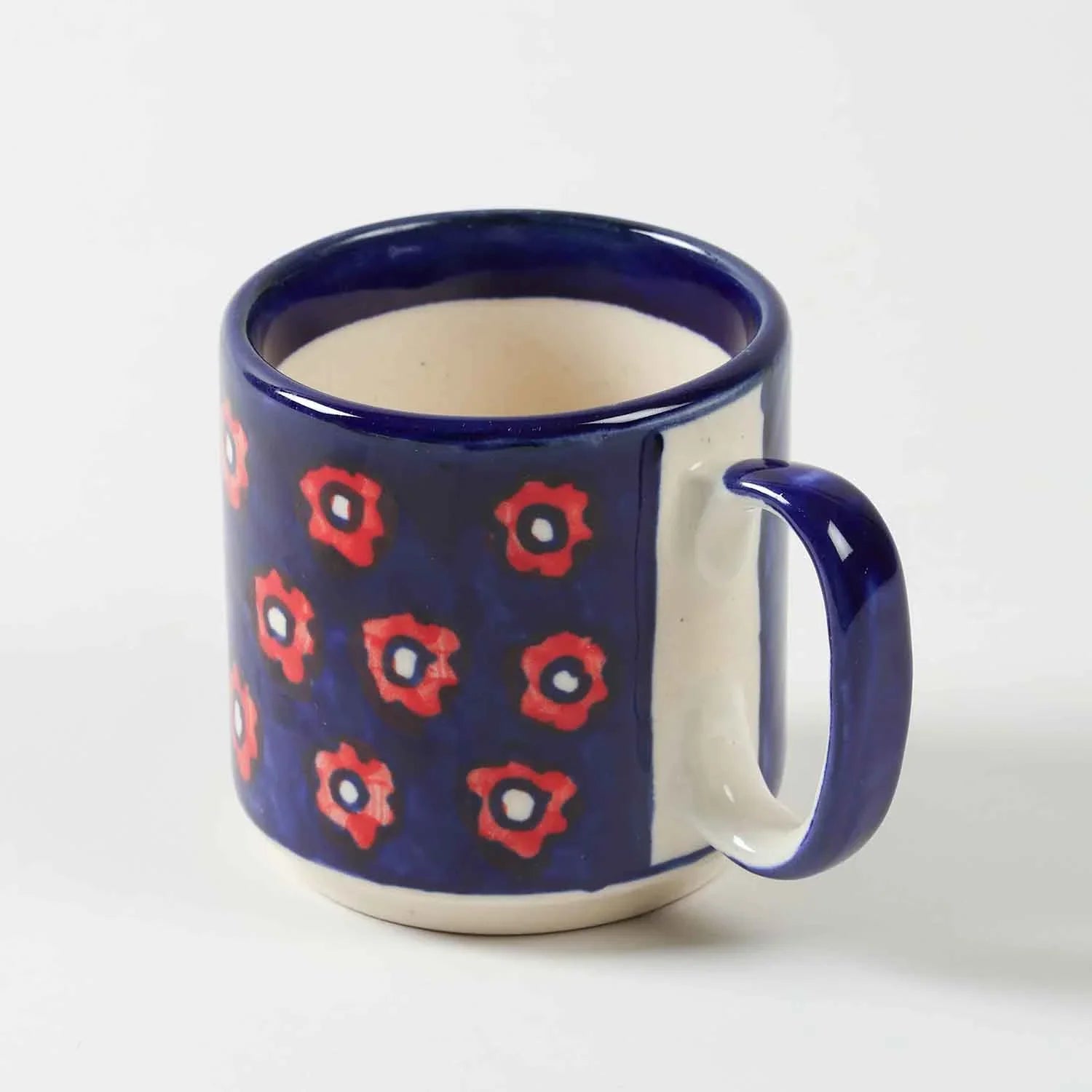 Single blue floral hand-painted ceramic mug displayed against a clean background showcasing handcrafted artwork and glossy finish