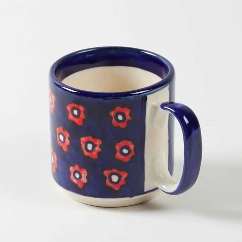 Single blue floral hand-painted ceramic mug displayed against a clean background showcasing handcrafted artwork and glossy finish