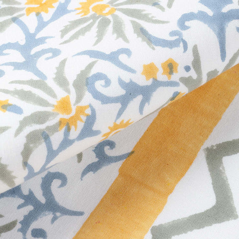 Close-up of floral block print and chevron border detailing on handcrafted cotton table runner