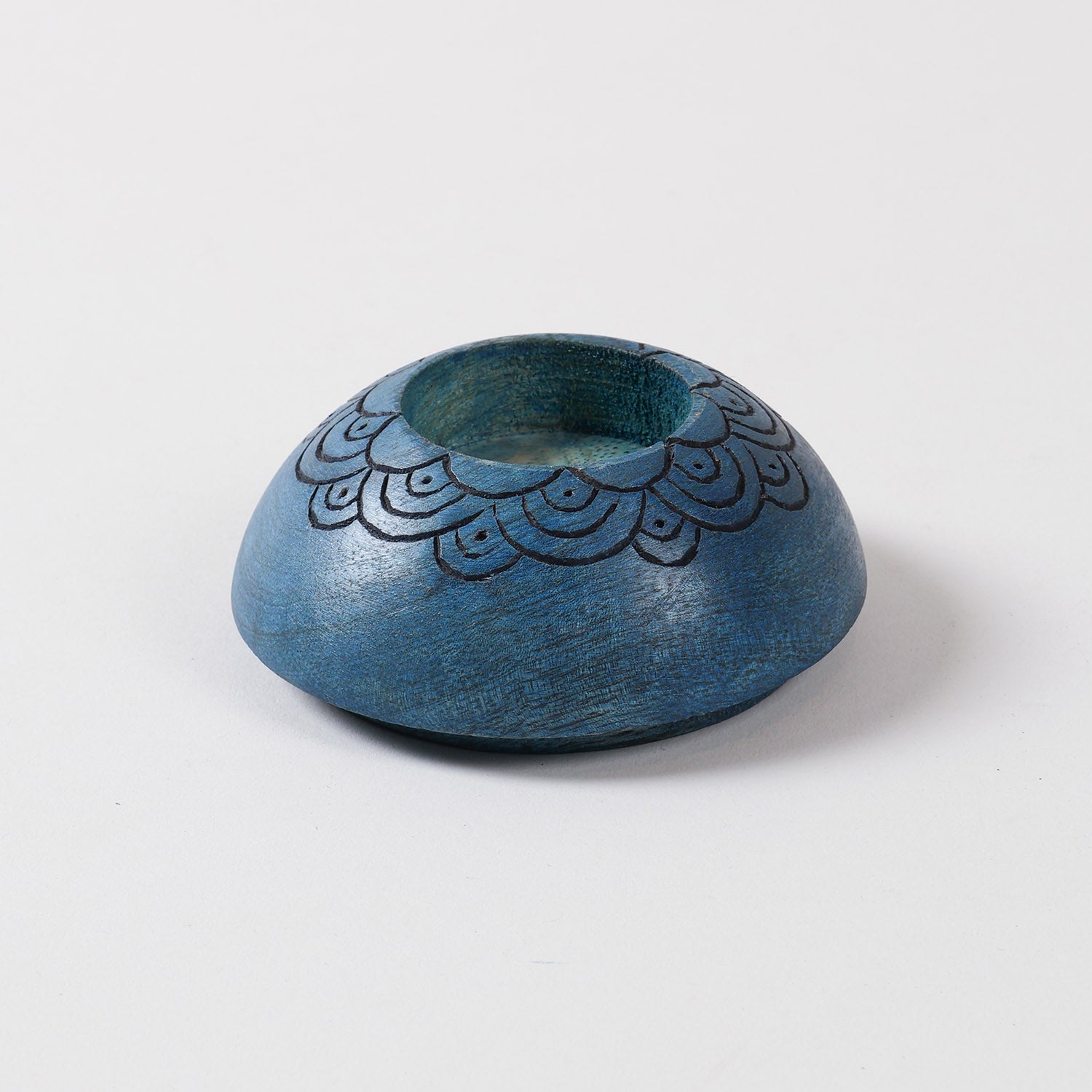 Blue wooden T-light candle holder featuring a hand carved scalloped pattern, ideal for decorative candle displays and wooden decor