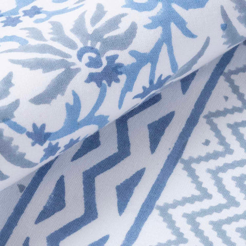 Macro view of blue floral vine block print patterns on a handcrafted cotton table runner