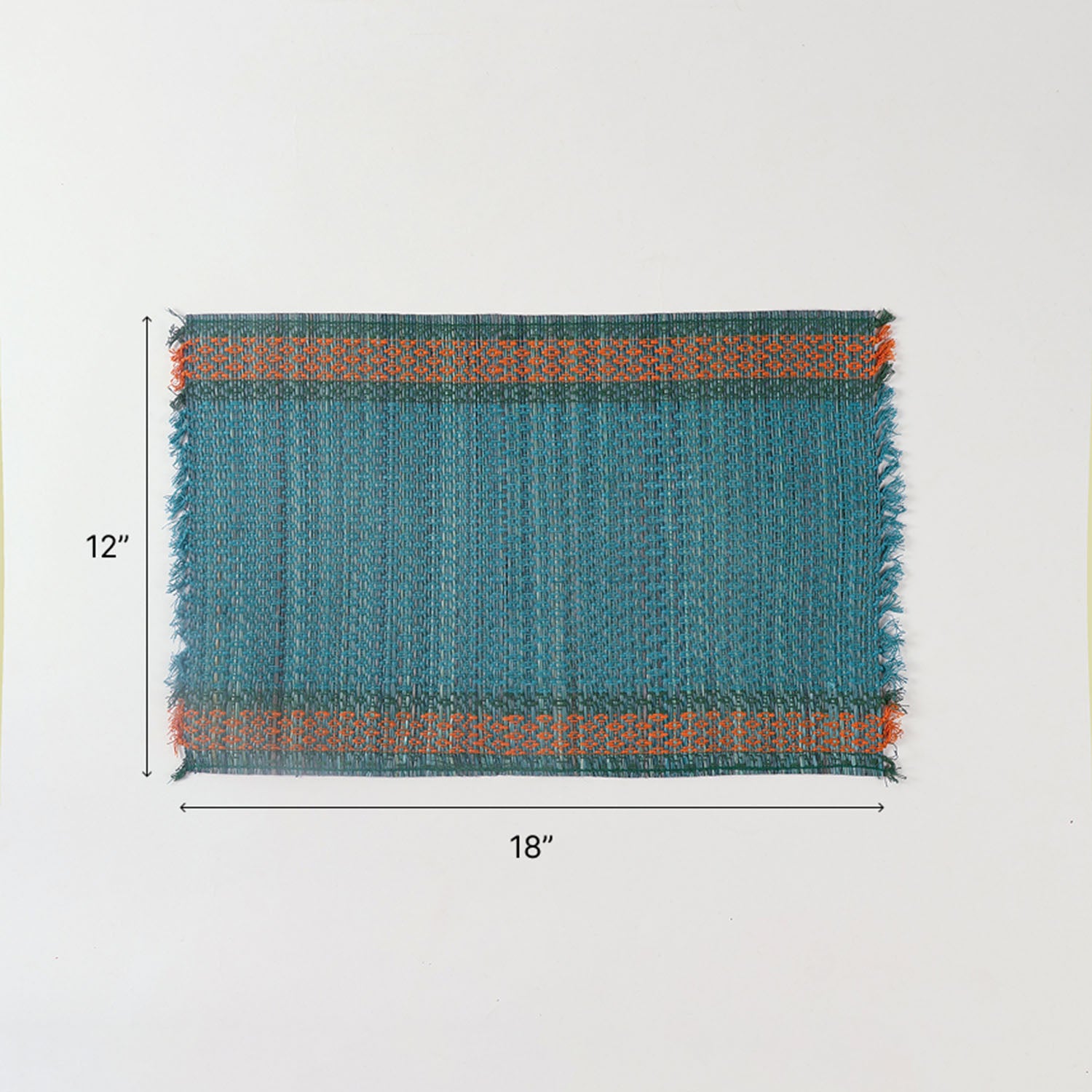 Size chart of blue Madhurkathi placemats showing dimensions of 12 x 18 inches for dining table settings