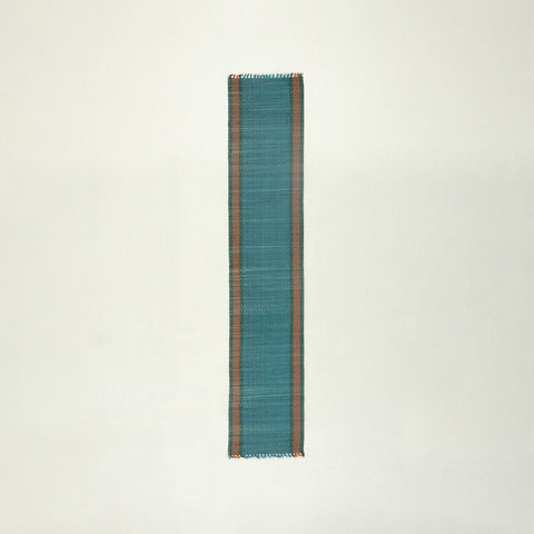 Full-length handmade blue Madhurkathi table runner crafted from natural river grass, ideal for dining table decor and table settings