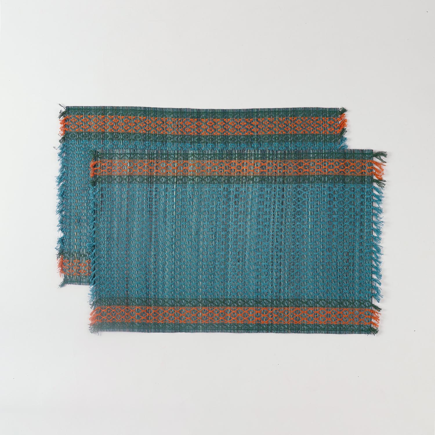 Set of 2 blue Madurkathi placemats displayed flat, showcasing handwoven river grass texture and colourful border accents