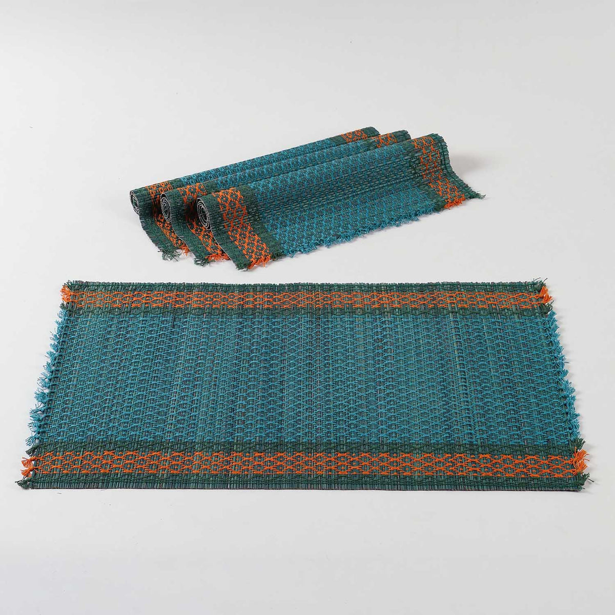 Blue natural fibre placemats crafted from Madurkathi grass, displayed as a dining table mat set of 4 with a handwoven texture