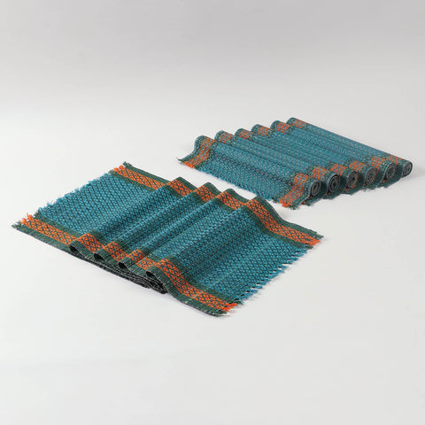 Handmade blue table runner and placemats set crafted from Madurkathi grass, showcasing natural fibre texture and colourful woven borders