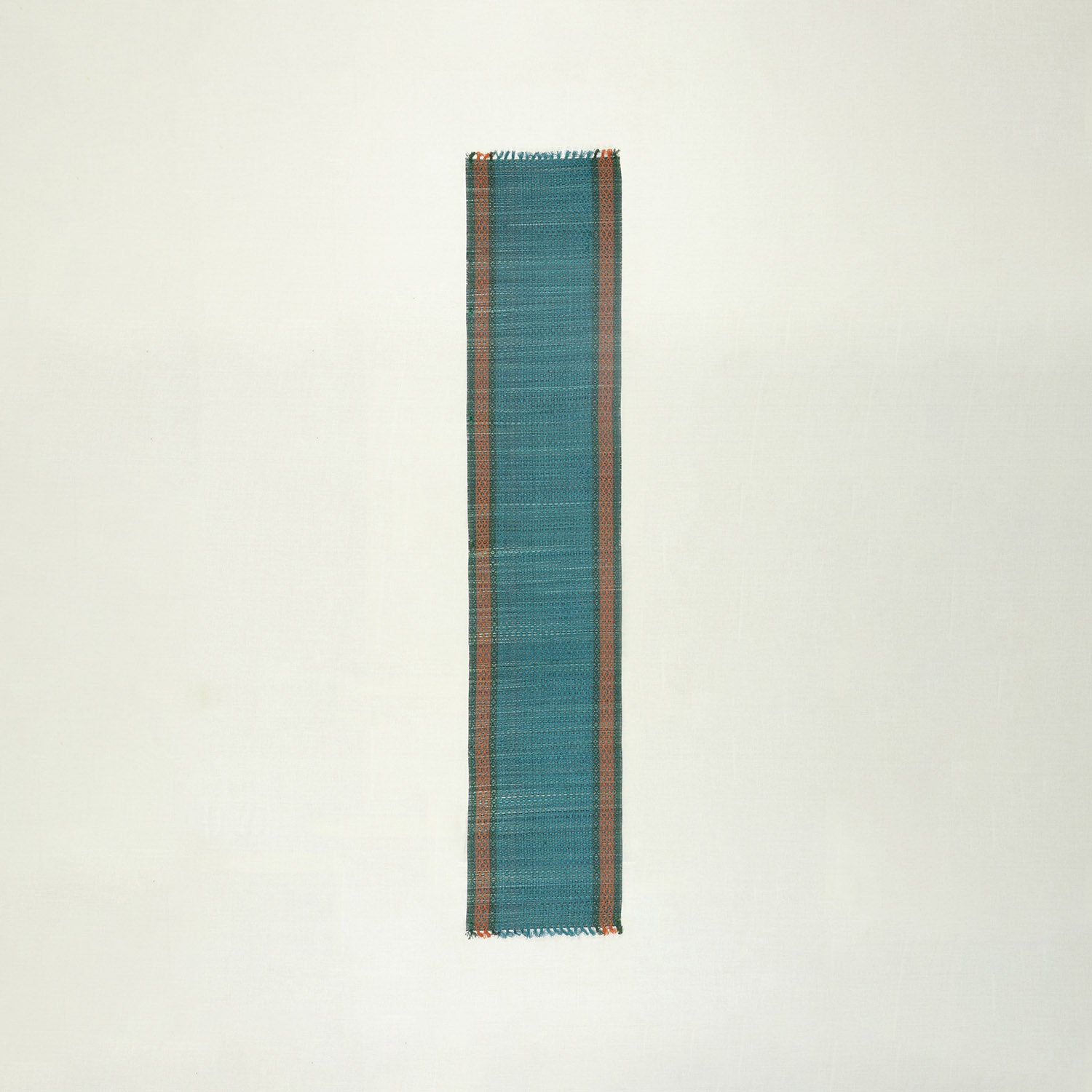 Full-length handmade blue Madurkathi table runner crafted from natural river grass, ideal for dining table decor and table settings