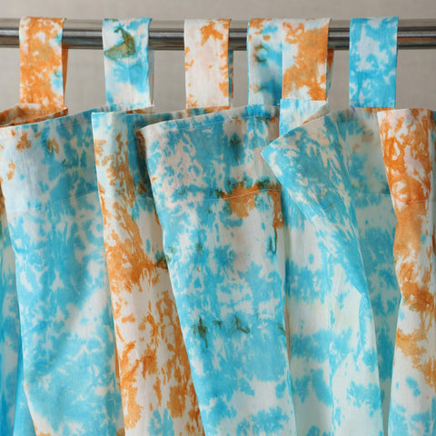 Handcrafted blue and orange tie-dye mulmul cotton curtain with top loops.