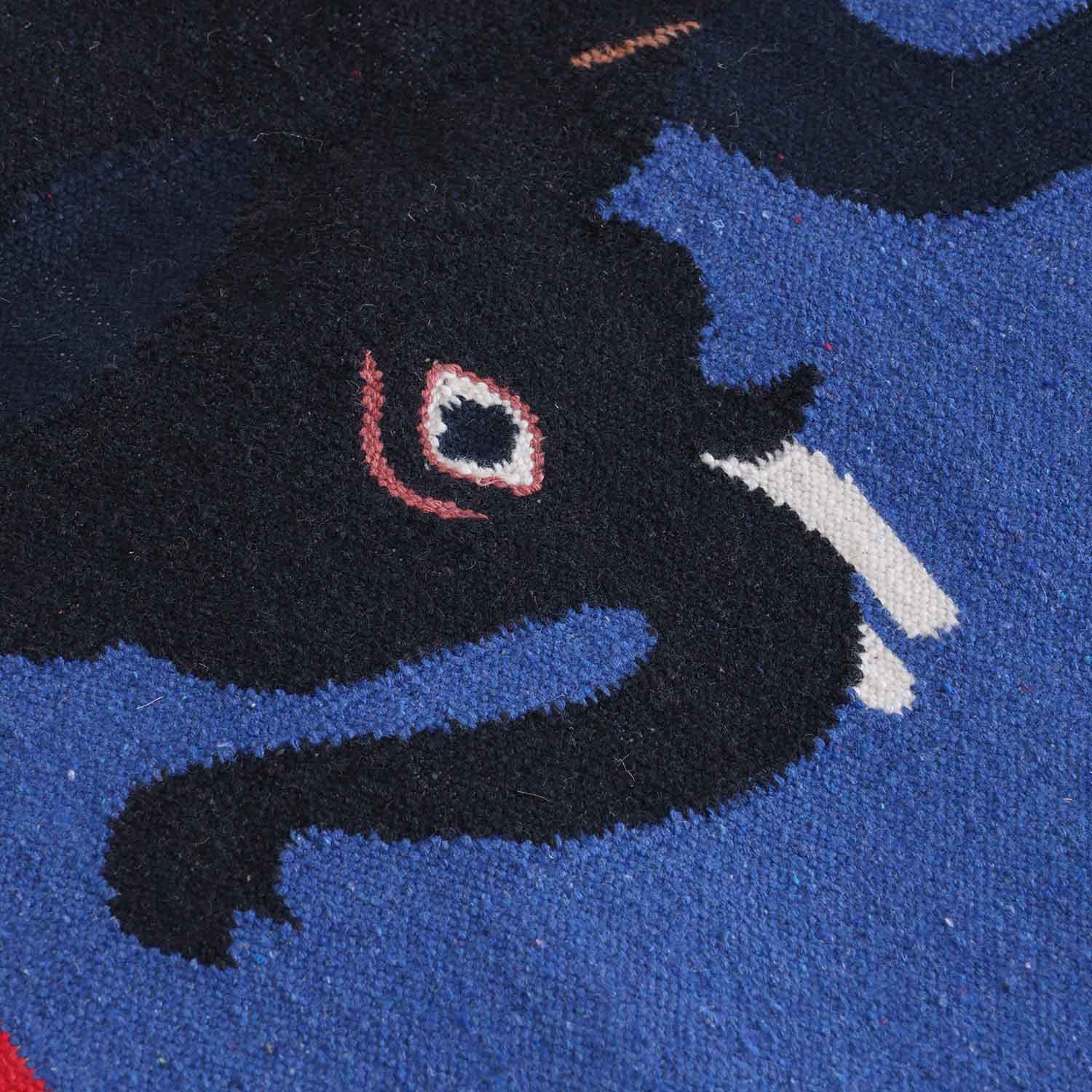 Close-up of camel and elephant motifs highlighting traditional Bikaner dhurrie weaving and artisan craftsmanship