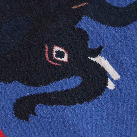 Close-up of camel and elephant motifs highlighting traditional Bikaner dhurrie weaving and artisan craftsmanship