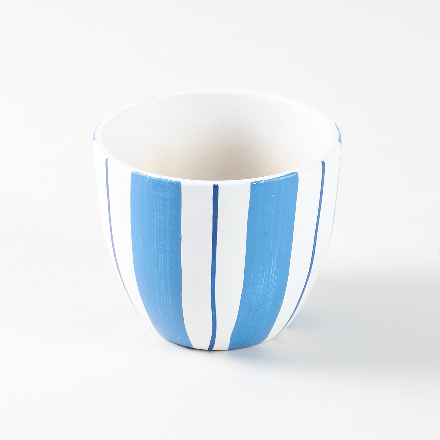 Ceramic planter shown in high angled view highlighting striped pattern and U-shaped design.
