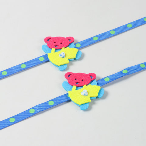 Close-up view of the handmade blue and yellow Teddy Bear Felt Kids Rakhi highlighting its soft felt design and colourful details.