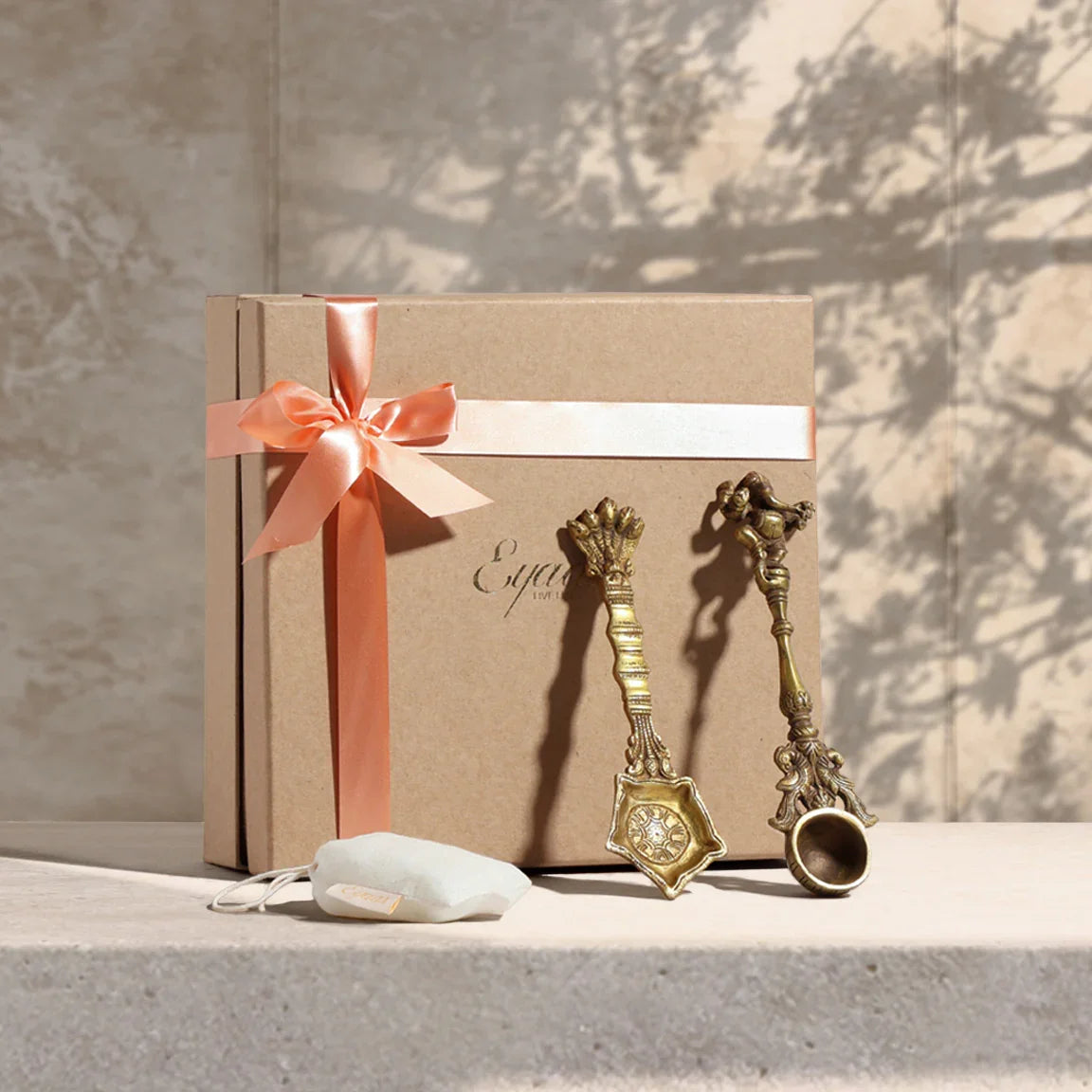 Gift set containing two handcrafted brass hawan spoons and natural Kapoor packed in a decorative gift box for puja and festive gifting