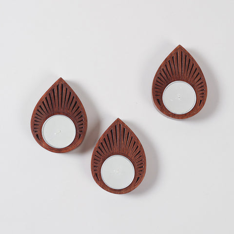 handcrafted wooden T-light candle holders with decorative brass inlay, arranged as a coordinated set of 3