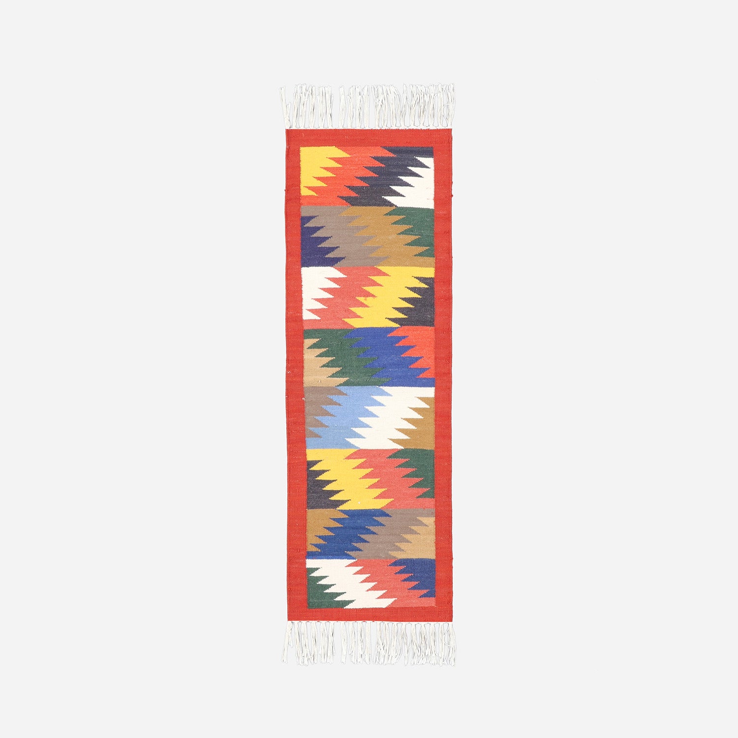 Handwoven cotton floor runner featuring geometric chevron patterns in brick red and multicoloured tones inspired by Bikaner dhurrie weaving