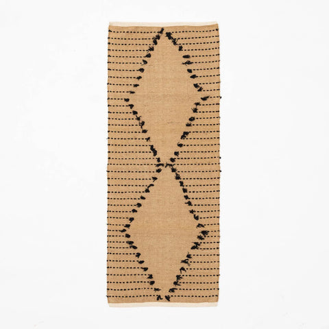 Brown hand-woven cotton dhurrie rug featuring black dotted stripe patterns across the surface