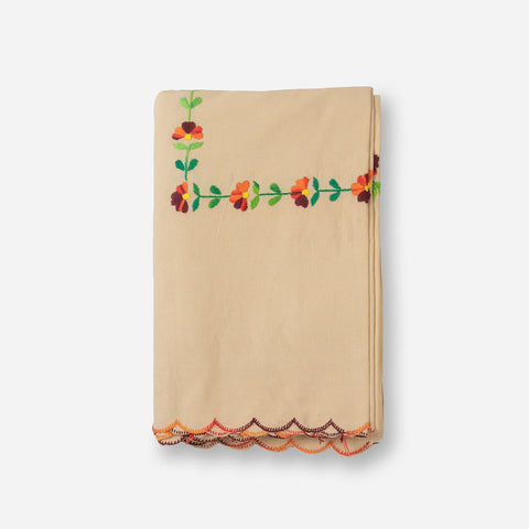 Folded brown cotton king size bedcover showcasing colourful Bengal chikankari embroidery and fabric texture
