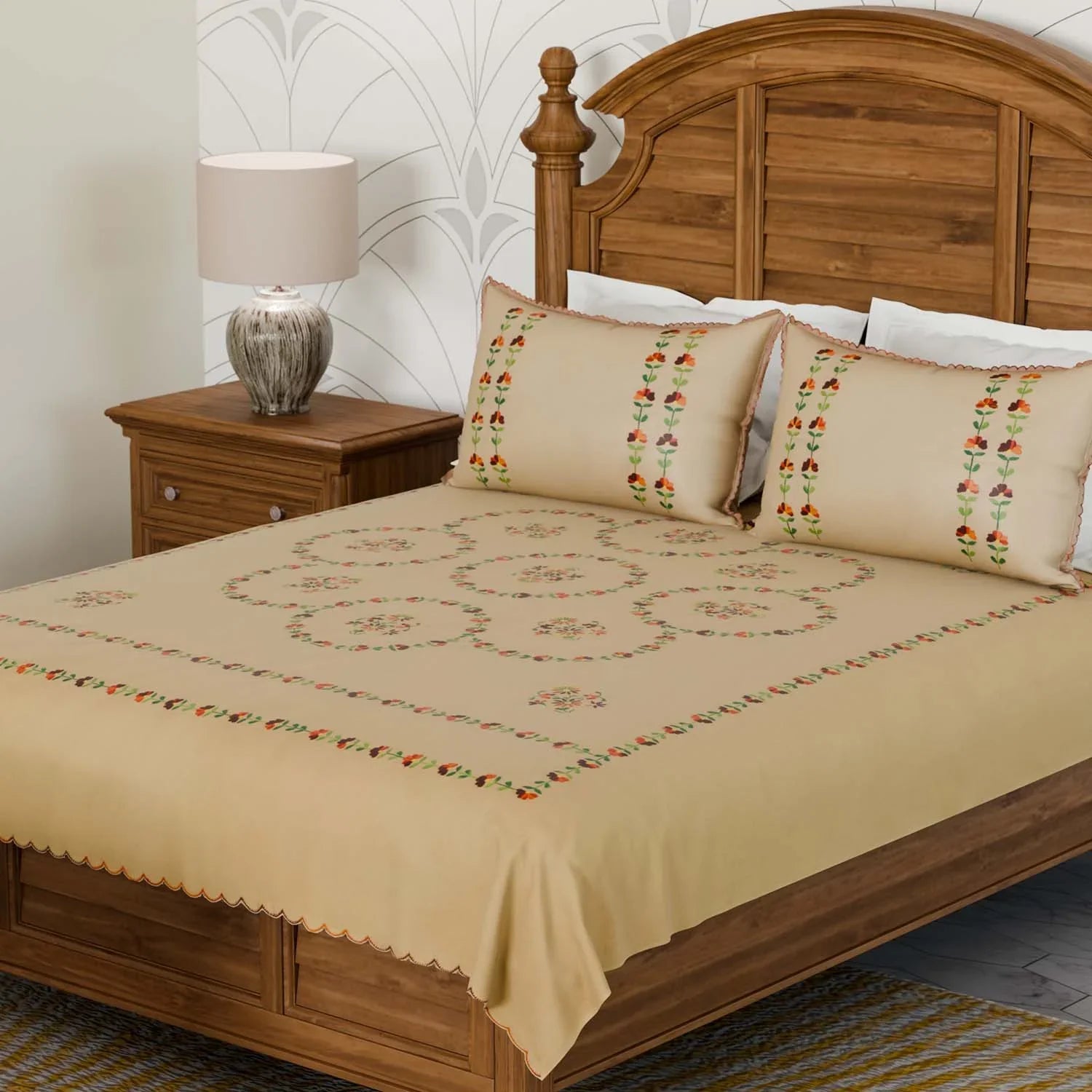 Brown cotton king-size bedcover with multicoloured Bengal chikankari hand embroidery and matching pillow cases styled in a warm bedroom setting