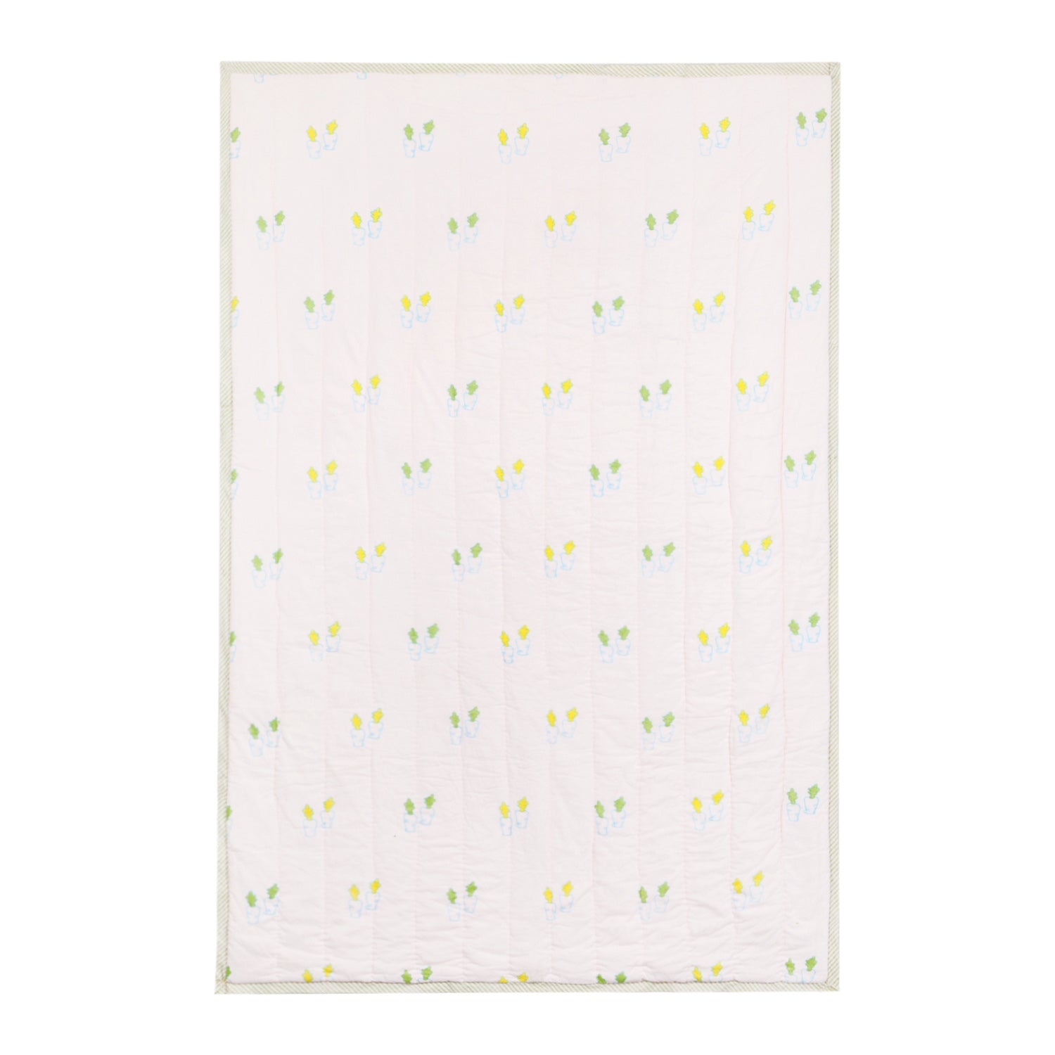  Back side of a reversible cotton quilt with coordinating  carrot block printed patterns in soft multicoloured tones