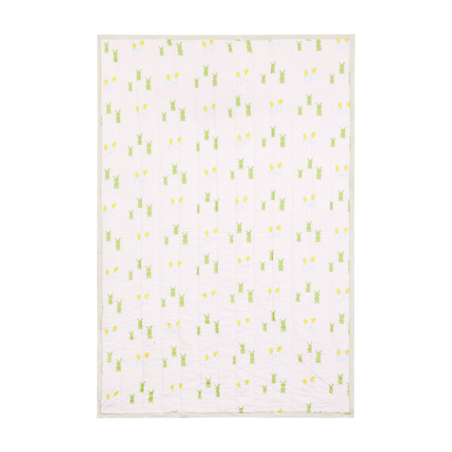 Full view of a 60x90 reversible cotton quilt featuring playful bunny and carrot motifs in pink, blue, green, and yellow tones